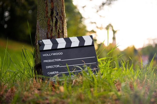 Clapperboard leaning on a tree