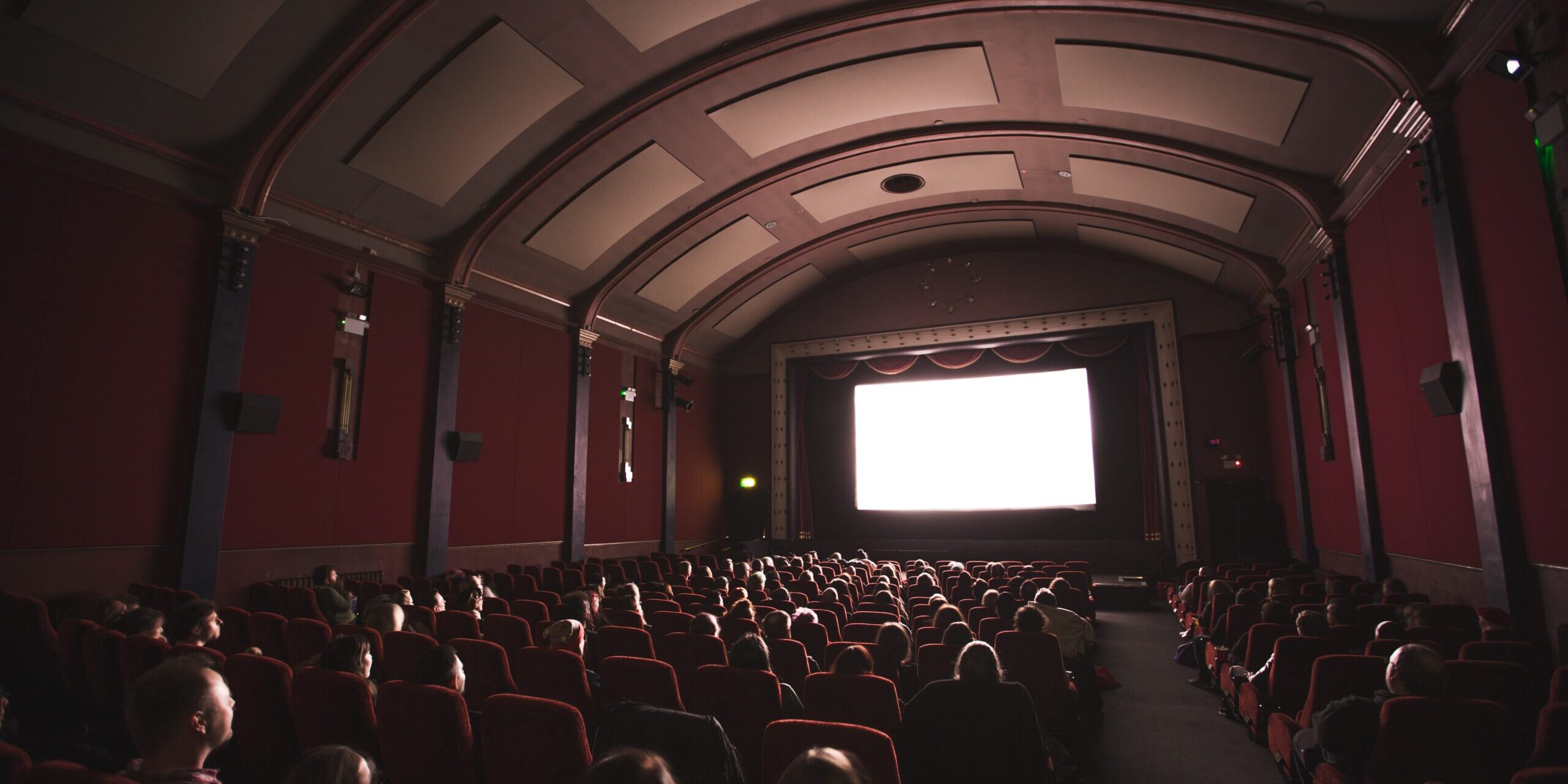 Audience watching cinema screen