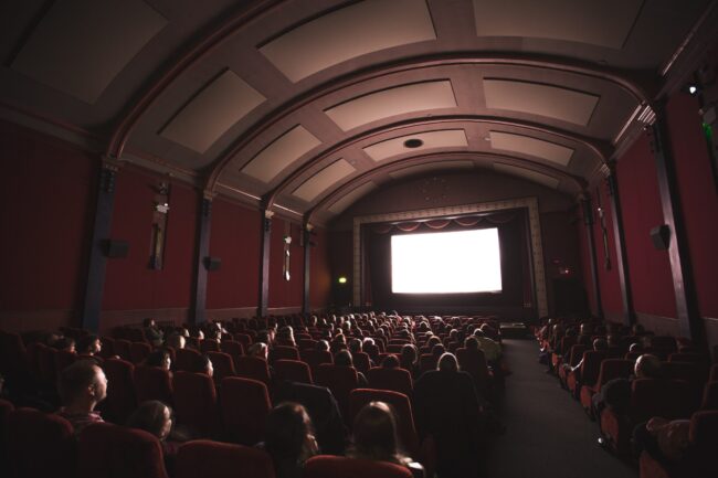 Audience watching cinema screen