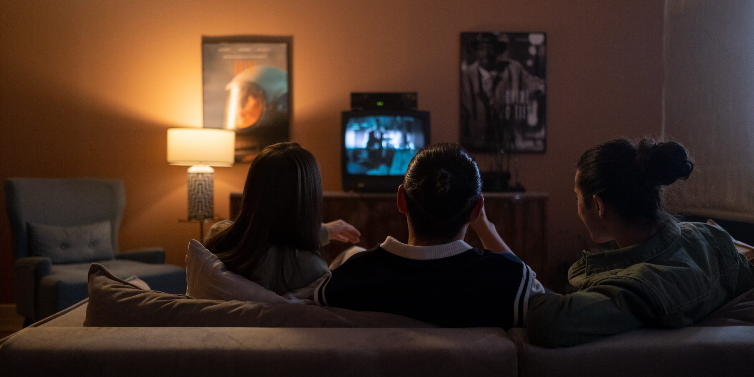 Family sitting and watching TV