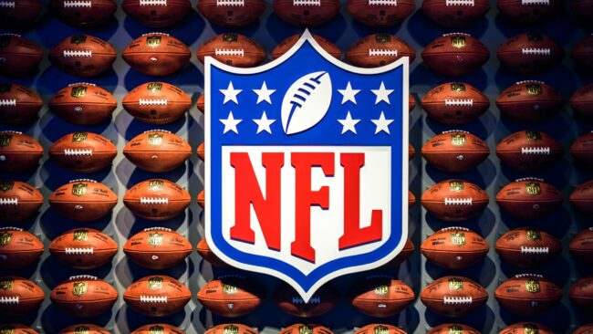 NFL Footbal logo with footballs in the background