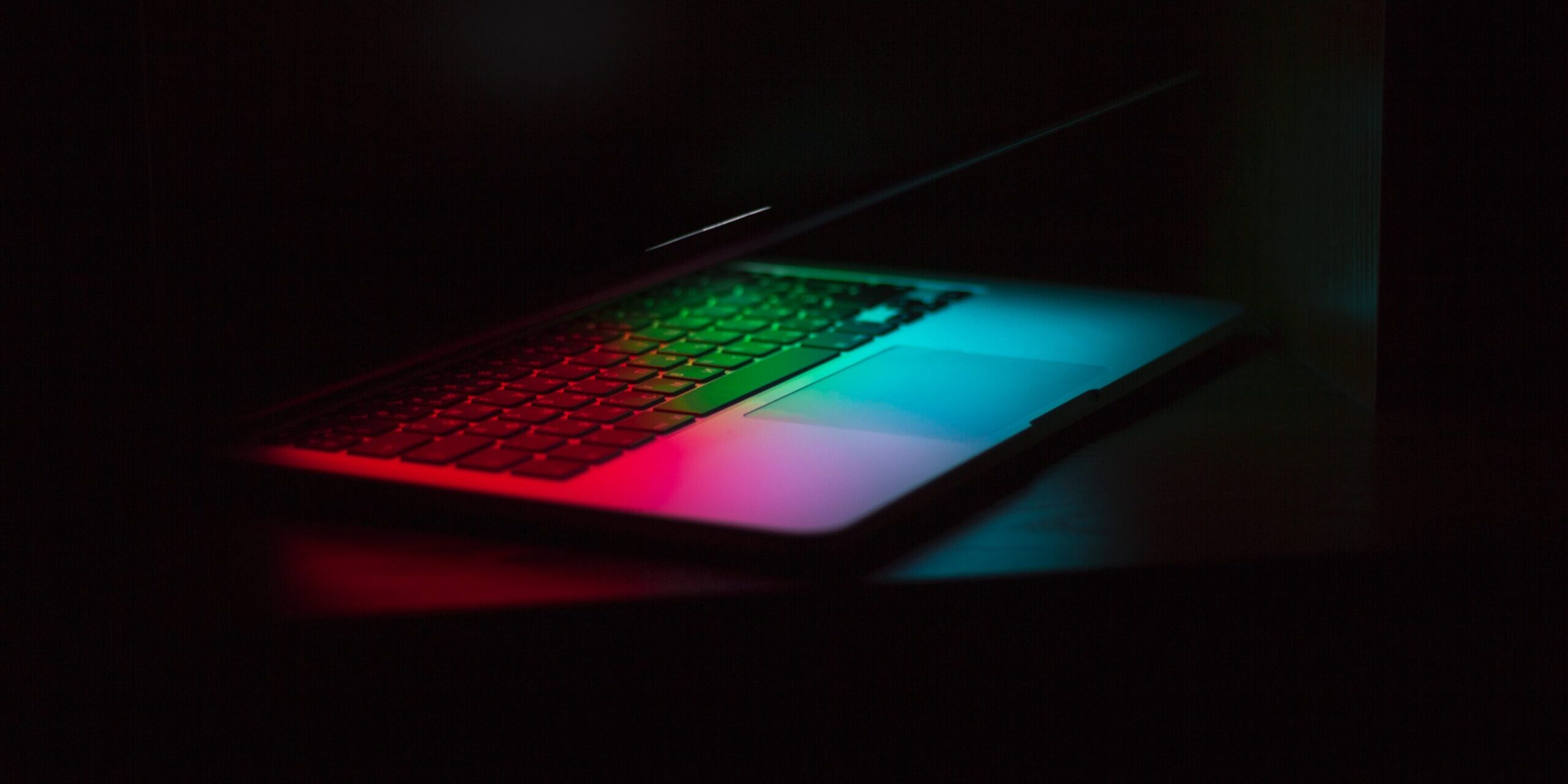 Open laptop with red, green, and blue light